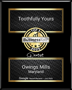 Award plaque for Toothfully Yours, recognized as a top dentist in Owings Mills, Maryland, featuring the BusinessRate logo and a 2025 designation.
