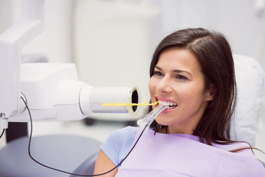 Patient receiving professional in-office teeth whitening treatment at a dental clinic in Owings Mills for a brighter smile.